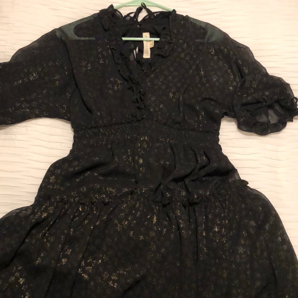 Black and gold polka dotted dress